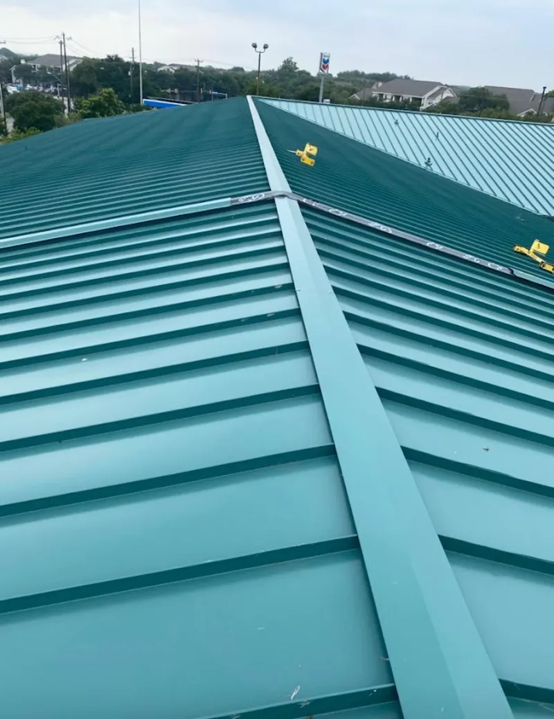Green commercial metal roof ridge and valley for Metal Roof Repair in Carthage