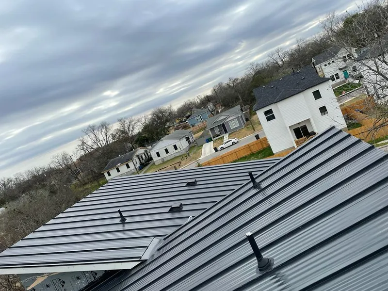 Standing seam metal roof panels with vents for Skylight Repair in Carthage